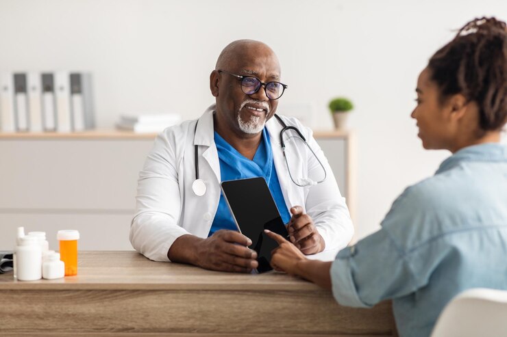 experienced-black-doctor-explaining-treatment-plan-female-patient